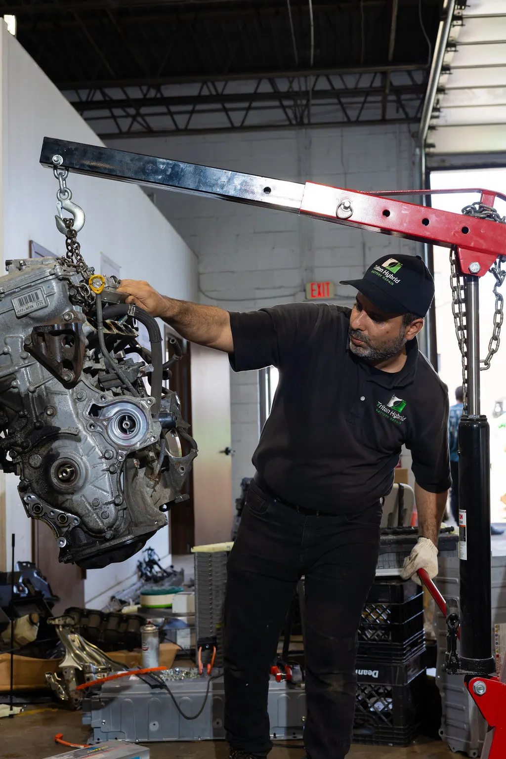 Sal working with an engine hoist at Triton