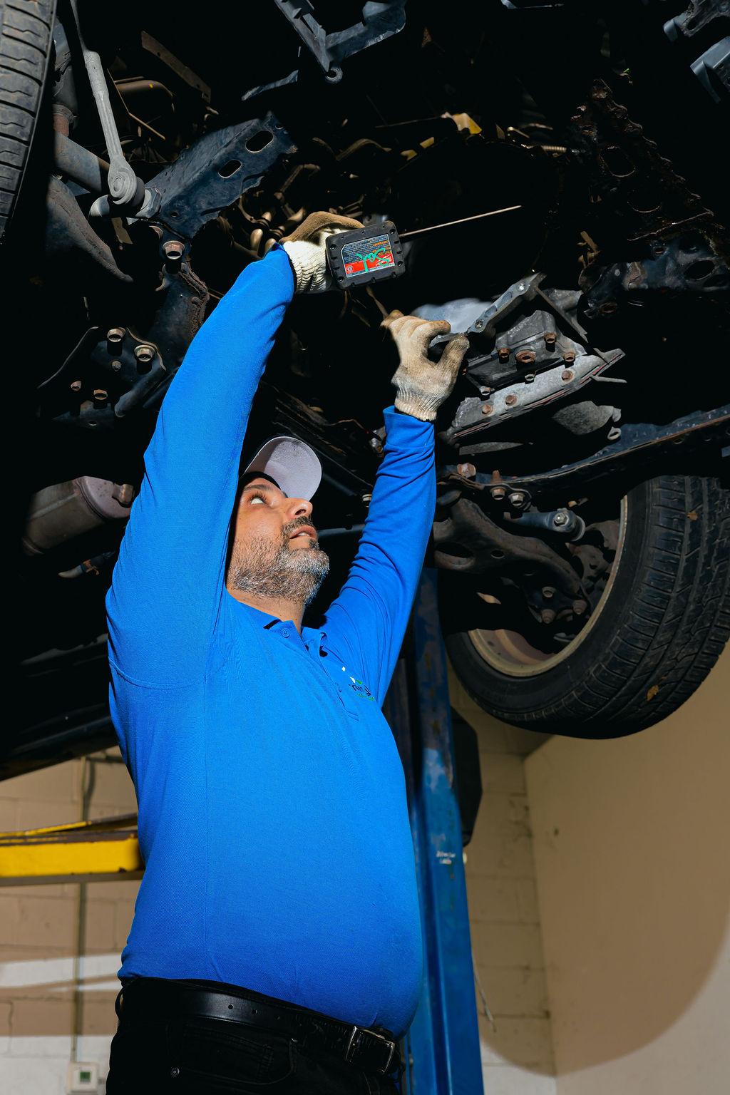 Undercarriage and transmission inspection on a lift at Triton in Lorton, VA