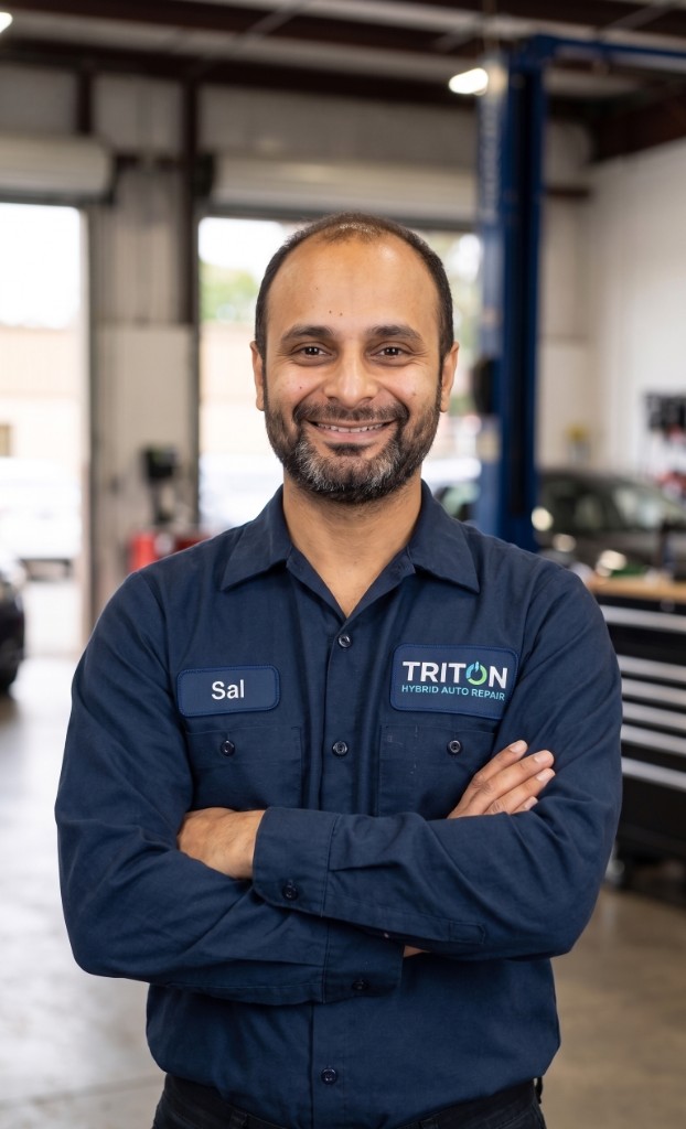 Sal, owner and lead technician at Triton Hybrid Battery Repair, in his Lorton shop